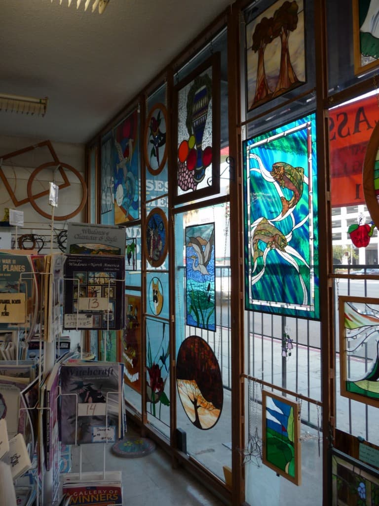 Wall of colorful art glass panels in the studio retail showroom